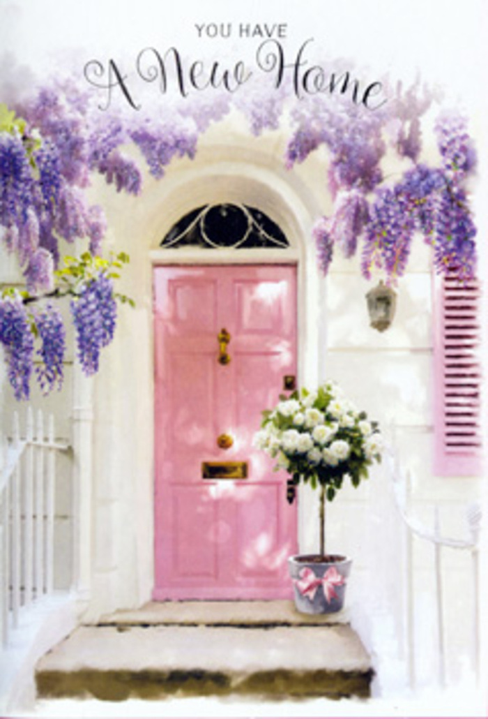 This photograph portrays an entrance that could easily be imagined on a quiet residential street just off East Heath Road, where Hampstead's charm meets the greenery of the Heath. The focal point is a pastel pink door, softly glowing in natural daylight, its tone gentle enough to evoke calm but cheerful enough to signal welcome. The surrounding wall is whitewashed, with a smooth texture that reflects the light in a diffused, flattering way, and a matching shutter painted in a similar muted hue. Draped above and around this frame, wisteria cascades in generous, tumbling strands of lavender. The blooms are dense and full, creating a natural archway that filters light and casts delicate, patterned shadows on the step and lower wall. There is a sense of the wisteria having grown and been gently trained over years, its mature, confident presence echoing the established feel of many Hampstead homes. Resting on the doorstep is a grey metal bucket repurposed as a charming container for an arrangement of white roses. The roses are lush and open, with velvety petals spiralling outwards from creamy centres, some flowers facing forward while others tilt slightly to the side, adding a sense of natural movement. Interspersed among the roses is fresh green foliage, providing texture, dimension, and a whisper of woodland fragrance that might echo a walk through nearby Vale of Health. A soft pink ribbon encircles the bucket, tied in a graceful bow that mirrors the colour of the door and subtly unites all the pastel elements in the scene. The resulting impression is one of quiet celebration-perfectly suited to a housewarming delivery in Hampstead-conveying heartfelt congratulations and a gentle reassurance that this new doorway will soon feel like the true heart of home.